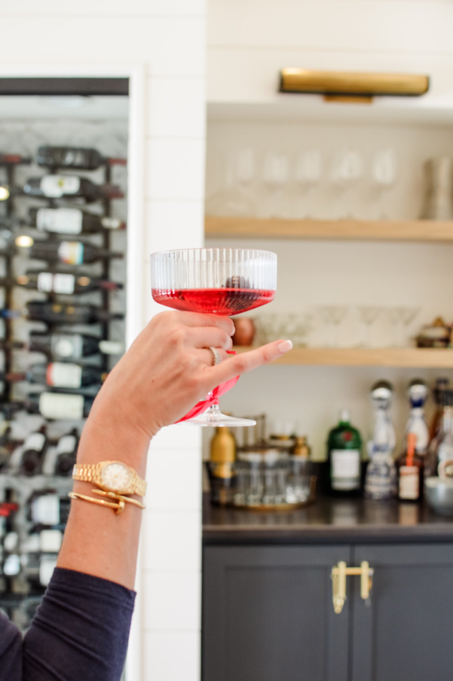 Hand holding a solstice drink, made with clean energy with added skin care benefits